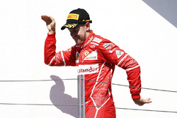 Podium: race winner Sebastian Vettel celebrates his victory on the podium