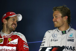 (L to R): Sebastian Vettel, Ferrari with Nico Rosberg, Mercedes AMG F1 in the FIA Press Conference