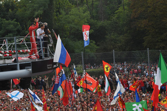 Second place Kimi Raikkonen, Ferrari celebrates on the podium with Felipe Massa