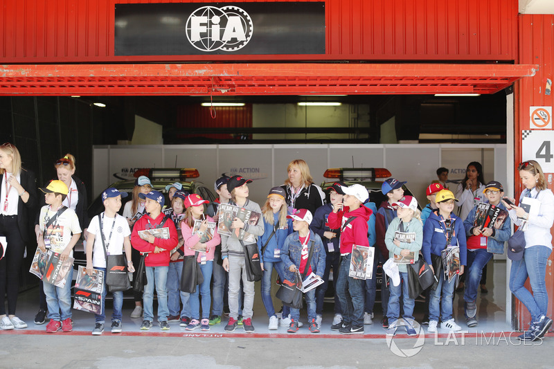 The grid kids in a garage