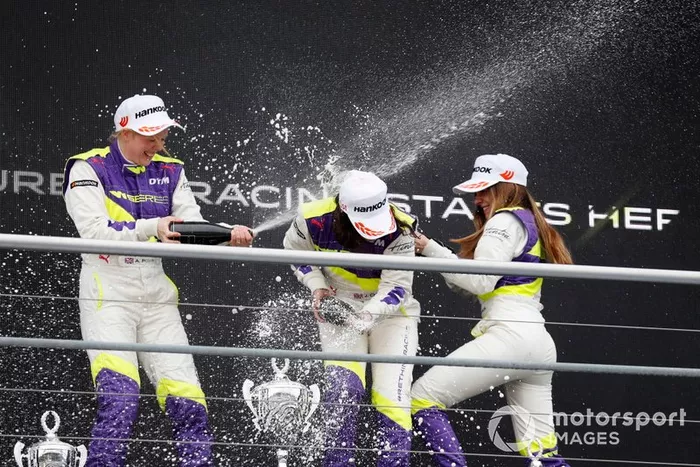 Jamie Chadwick celebrates on the podium with Alice Powell and Marta Garcia