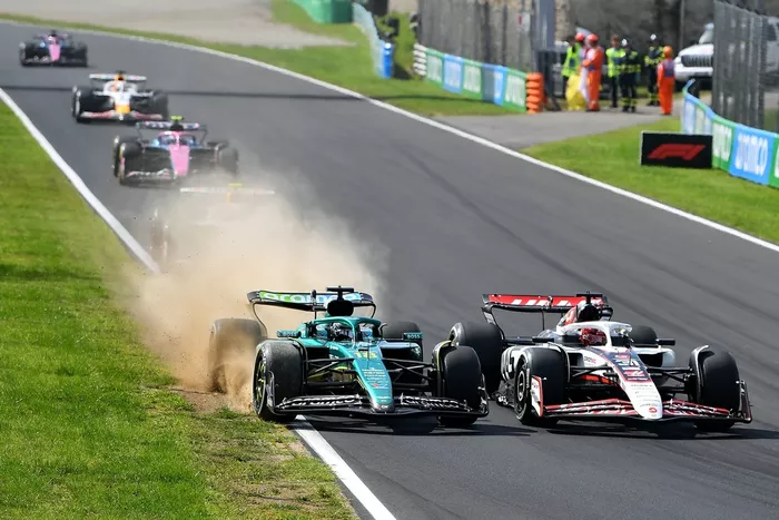 Lance Stroll, Aston Martin Racing, Esteban Ocon, Haas F1 Team