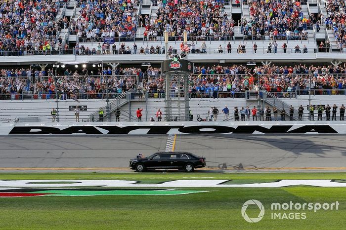 President Donald J. Trump and First Lady Melania Trump ride in the presidential car as they lead the field on the parade lap at the Daytona 500