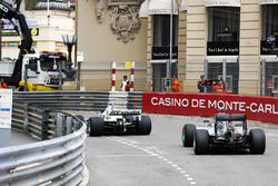 Keke Rosberg leads his son Nico Rosberg as they lap the circuit in their respective Championship winning cars