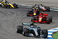 Valtteri Bottas, Mercedes AMG F1 W09, leads Kimi Raikkonen, Ferrari SF71H, and Max Verstappen, Red Bull Racing RB14
