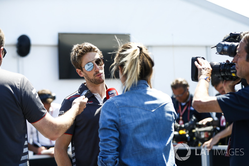 Romain Grosjean, Haas F1 Team, speaks to a reporter