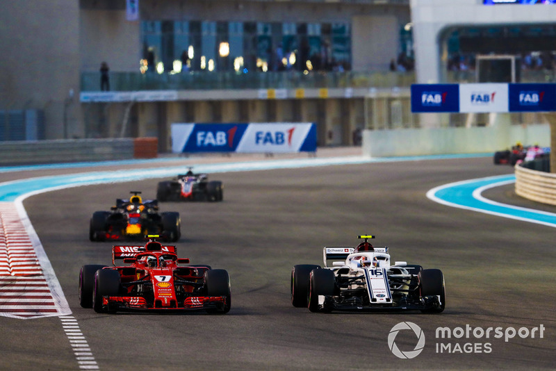 Charles Leclerc, Sauber C37, battles with Kimi Raikkonen, Ferrari SF71H, ahead of Daniel Ricciardo, Red Bull Racing RB14