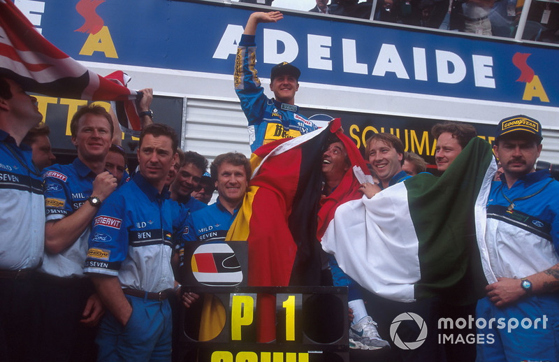 Michael Schumacher, Benetton celebrates with Flavio Briatore, Tom Walkinshaw and the team