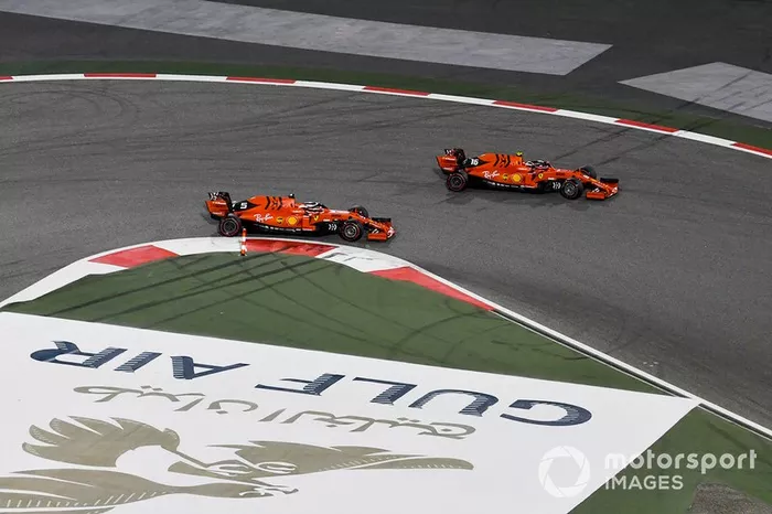 Charles Leclerc, Ferrari SF90 overtakes Sebastian Vettel, Ferrari SF90 for the lead of the race
