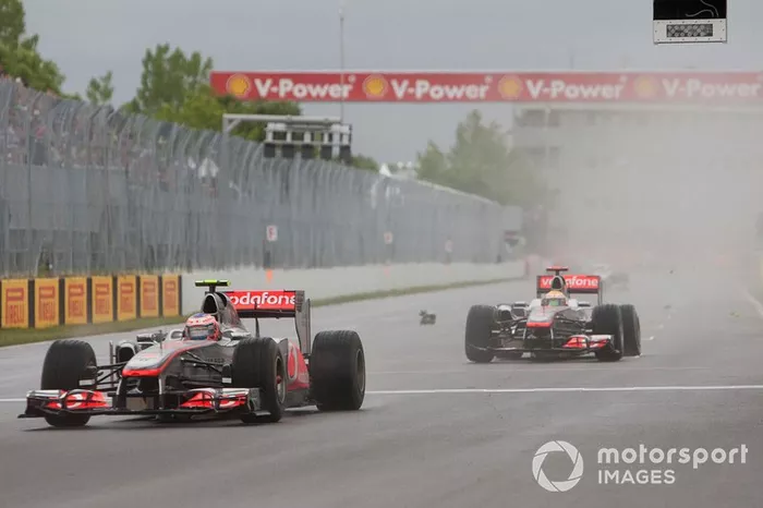 Jenson Button, McLaren MP4-26 Mercedes, leads Lewis Hamilton, McLaren MP4-26 Mercedes
