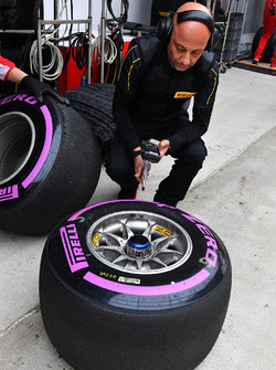 Ferrari and Pirelli engineers with Pirelli tyres