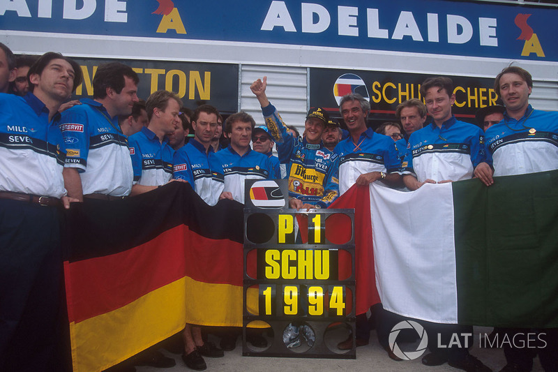 Michael Schumacher celebrates becoming World Champion with Flavio Briatore, Tom Walkinshaw and the r