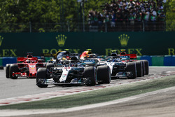 Lewis Hamilton, Mercedes AMG F1 W09 leads the pack in the first corner