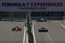 Sebastian Vettel, Ferrari SF70H and Romain Grosjean, Haas F1 Team VF-17