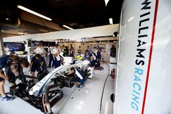 Engineers work on the car of Valtteri Bottas, Williams FW38