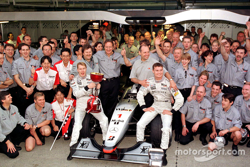 The McLaren team celebrate winning the Constructors Championship with the new World Champion Mika Ha