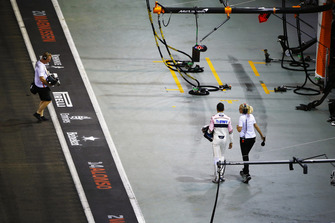 Esteban Ocon, Racing Point Force India, walks back to the pits after a crash