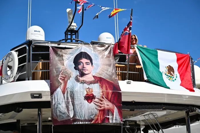 A banner representing Ferrari's Monegasque driver Charles Leclerc as a Saint