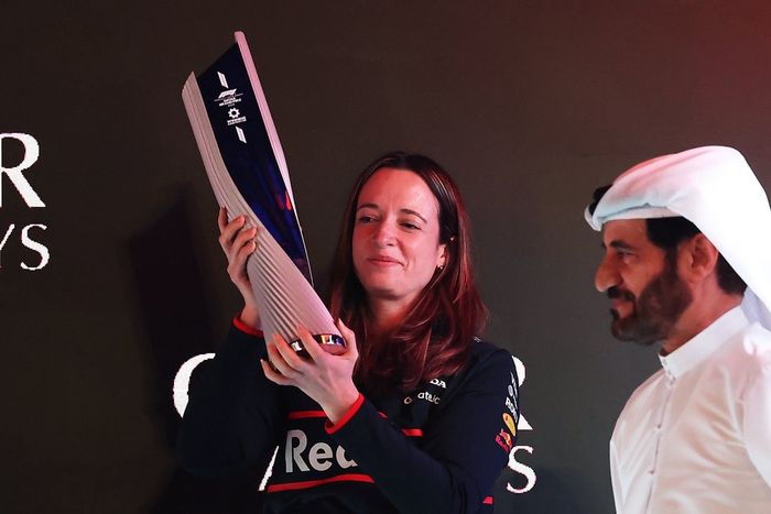Hannah Schmitz, Principal Strategy Engineer of Oracle Red Bull Racing collects the Constructors trophy on the podium during the F1 Grand Prix of Qatar