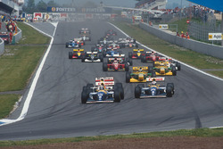 Damon Hill leads Alain Prost, both Williams FW15C Renault's, Ayrton Senna, McLaren MP4/8 Ford, Michael Schumacher, Riccardo Patrese, both Benetton B193B Ford's, Jean Alesi, Ferrari F93A, and Michael Andretti, McLaren MP4/8 Ford, at the start