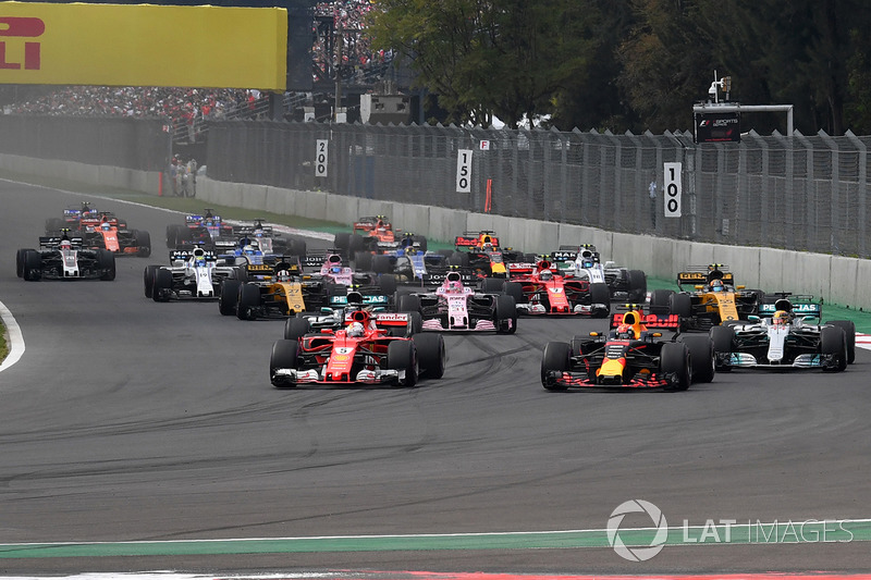 Max Verstappen, Red Bull Racing RB13 and Sebastian Vettel, Ferrari SF70H battle at the start of the race