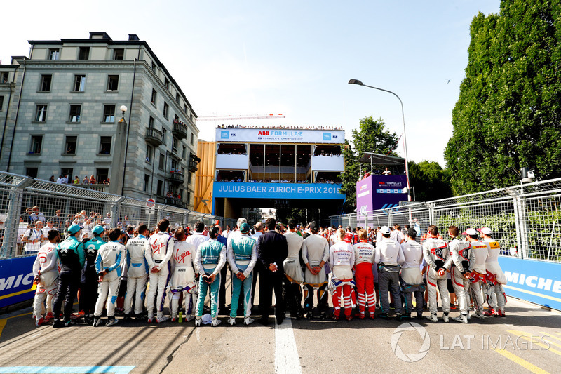 Drivers line up on the grid