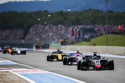 Romain Grosjean, Haas F1 Team VF-18, leads Sergio Perez, Force India VJM11, and Nico Hulkenberg, Renault Sport F1 Team R.S. 18