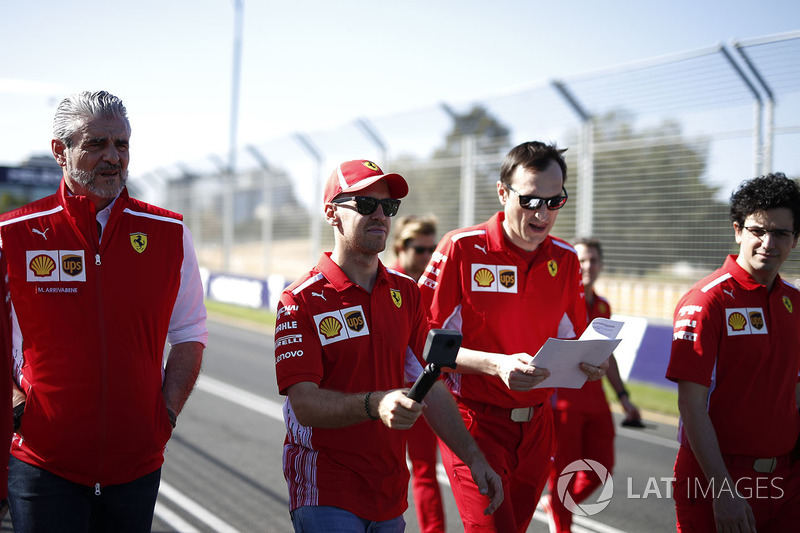 Sebastian Vettel, Ferrari, Riccardo Adami, Ferrari Race Engineer, Maurizio Arrivabene, Ferrari Team Principal walk the track