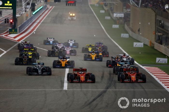 Sebastian Vettel, Ferrari SF90, Charles Leclerc, Ferrari SF90, Lewis Hamilton, Mercedes AMG F1 W10, Valtteri Bottas, Mercedes AMG W10, Max Verstappen, Red Bull Racing RB15, Kevin Magnussen, Haas F1 Team VF-19, and the rest of the field at the start