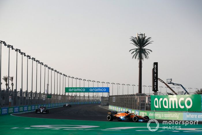 Lando Norris, McLaren MCL35M, Kimi Raikkonen, Alfa Romeo Racing C41, Mick Schumacher, Haas VF-21.