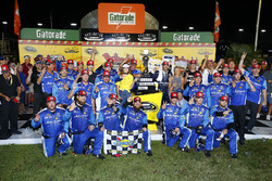 Race winner Martin Truex Jr., Furniture Row Racing Toyota with his crew