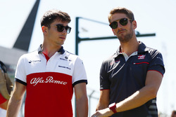 Charles Leclerc, Sauber, with Romain Grosjean, Haas F1 Team