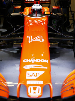 Fernando Alonso, McLaren, in cockpit, in garage, with helmet visor down