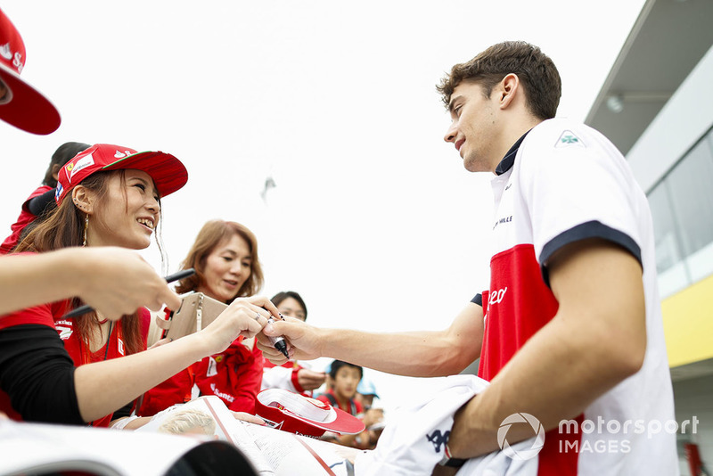 Charles Leclerc, Sauber, signs an autograph for fans