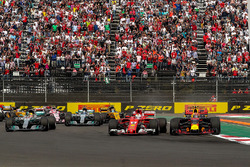 Max Verstappen, Red Bull Racing RB13 leads at the start of the race and collides with Sebastian Vettel, Ferrari SF70H