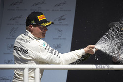 Second place Valtteri Bottas, Mercedes AMG F1, sprays Champagne on the podium