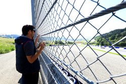 Mark Webber watches as Marc Marquez, tests the Toro Rosso F1 car