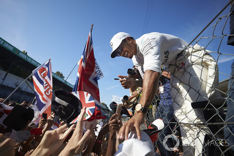Lewis Hamilton, Mercedes AMG F1, signs autographs for fans