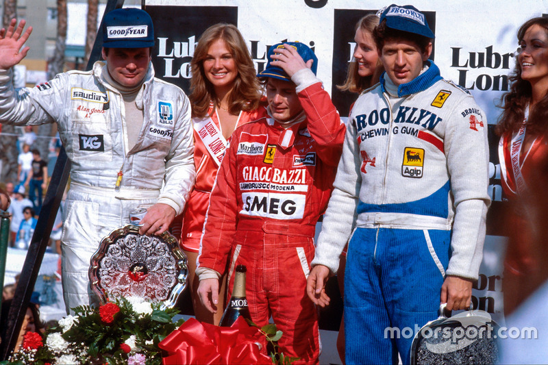 Gilles Villeneuve, 1st position, Jody Scheckter, 2nd position and Alan Jones, 3rd position on the podium