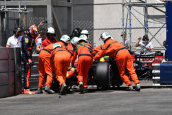 Marshals recover the crashed car of Max Verstappen, Red Bull Racing RB14