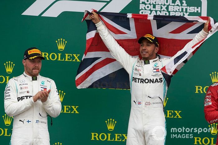 Valtteri Bottas, Mercedes AMG F1, 2nd position, and Lewis Hamilton, Mercedes AMG F1, 1st position, on the podium