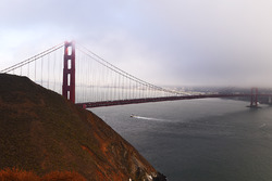 Fog hides part of the Golden Gate Bridge