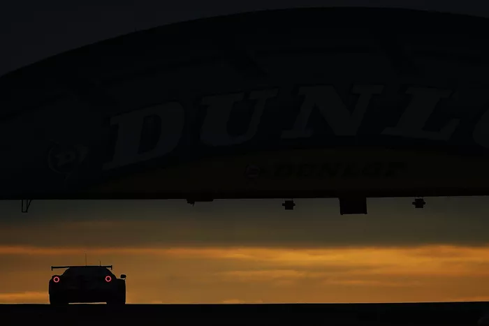 #70 MR Racing Ferrari 488 GTE: Motoaki Ishikawa, Olivier Beretta, Eddie Cheever drives under the Dunlop Bridge at dawn