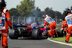 The car of race retiree Brendon Hartley, Scuderia Toro Rosso is recovered by Marshals after stopping on track with engine failure