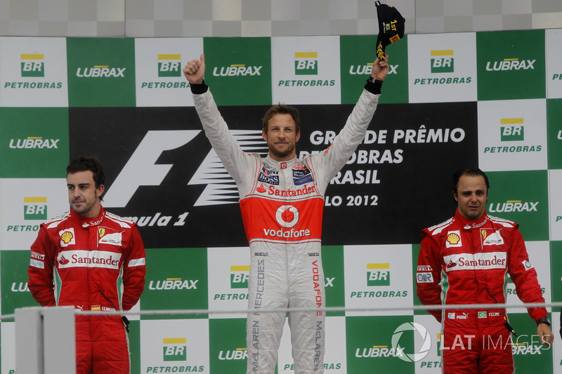 Podium: second place Fernando Alonso, Ferrari, Race winner Jenson Button, McLaren, third place Felip