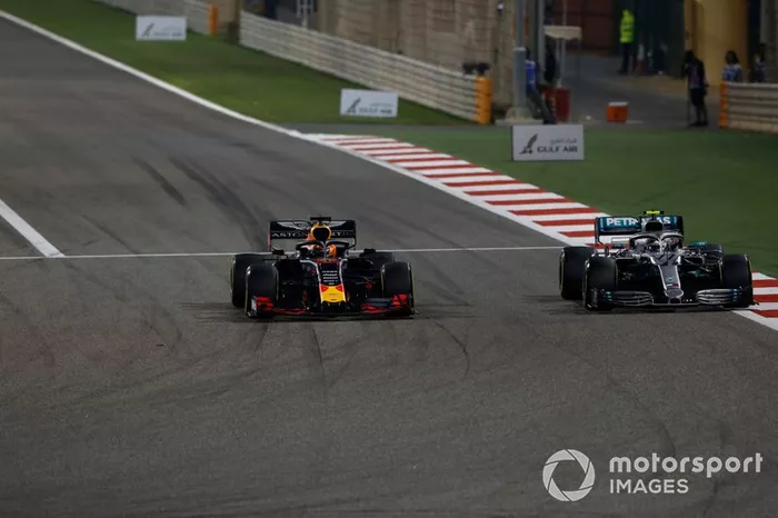 Max Verstappen, Red Bull Racing RB15, battles with Valtteri Bottas, Mercedes AMG W10