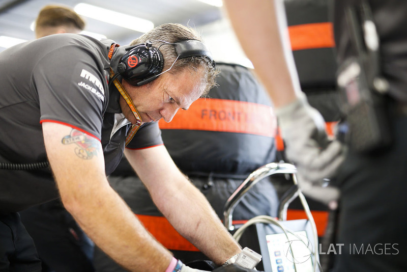 A Haas F1 engineer at work in the garage