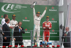 The podium (L to R): second place Lewis Hamilton, Mercedes AMG F1; Race winner Nico Rosberg, Mercede