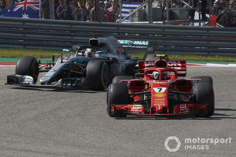 Kimi Raikkonen, Ferrari SF71H, leads Lewis Hamilton, Mercedes AMG F1 W09 EQ Power+