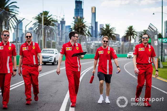 Sebastian Vettel, Ferrari walks the track with members of the team